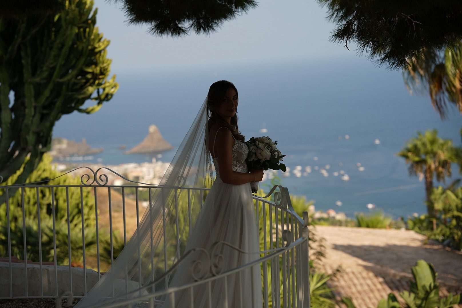 Bride silhouette overlooking the sea in Sicily